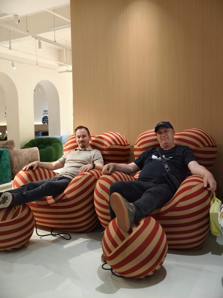 Visitors trying striped lounge chairs