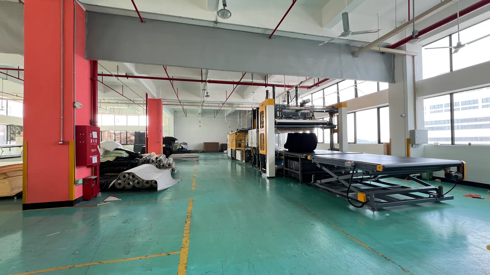 Outbound warehouse with neatly stacked wrapped sofas